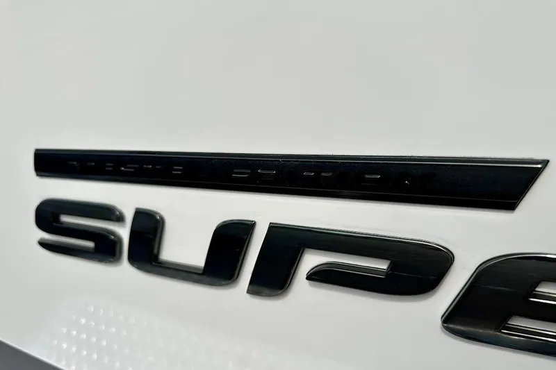 Slide: The Image of Close-up of 2018 Correct Craft Super Air Nautique GS22 logo on white surface. - 10