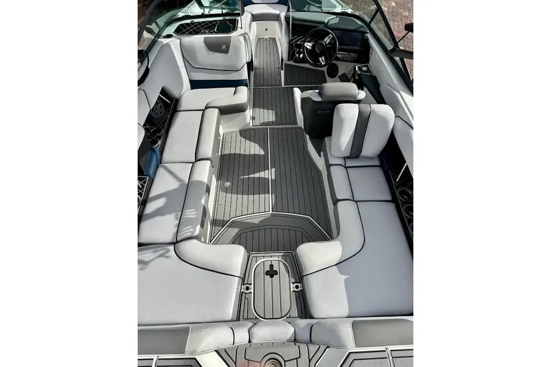 Slide: The Image of 2018 Correct Craft Super Air Nautique GS22 interior with gray seating and sleek design. - 25