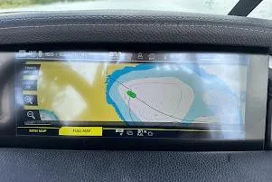 Slide: The Image of 2018 Correct Craft Super Air Nautique GS22 navigation display showing a detailed map interface. - 50