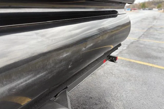 Slide: The Image of 2025 Regency 250 DL3 pontoon boat close-up, showing sleek metallic exterior. - 19