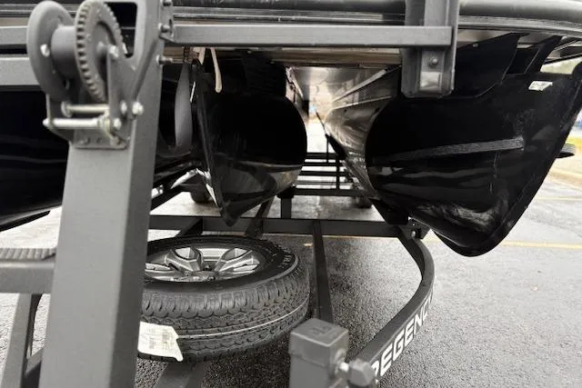 Slide: The Image of Underneath view of a 2025 Regency 250 DL3 pontoon boat on a trailer. - 21