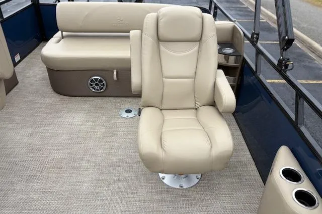 Slide: The Image of Luxurious seating on 2025 Regency 250 DL3 pontoon boat with beige upholstery. - 25