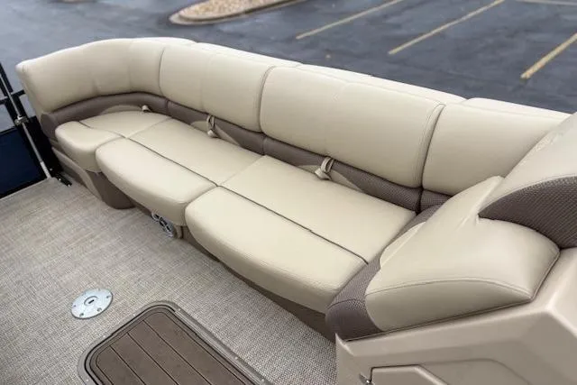 Slide: The Image of Luxurious seating on 2025 Regency 250 DL3 pontoon boat, featuring beige upholstery. - 28