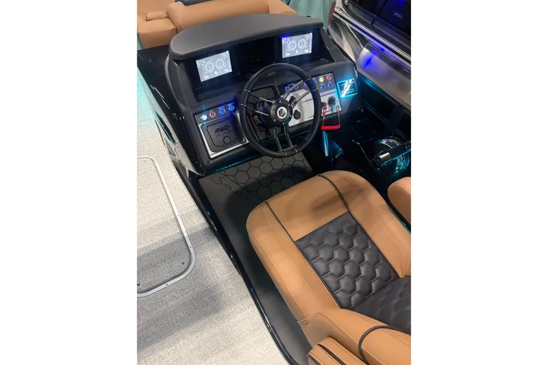 Slide: The Image of 2026 South Bay 525RS pontoon boat with luxurious seating in showroom. - 2