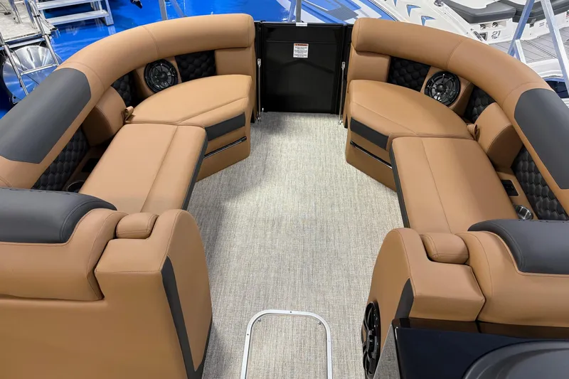 Slide: The Image of Luxurious interior of 2026 South Bay 525RS pontoon boat with tan seating. - 8