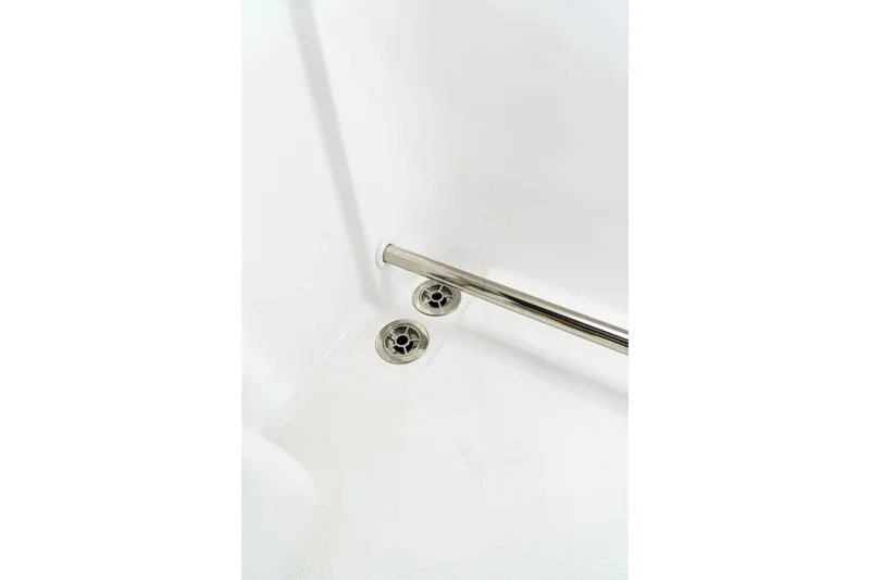 Slide: The Image of Edgewater 230CC 2026 boat drain and railing detail, showcasing stainless steel finish. - 6