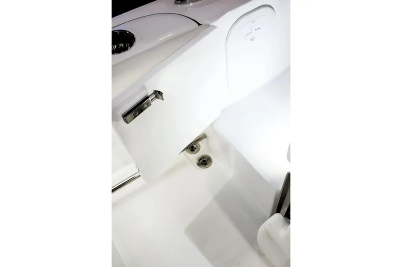 Slide: The Image of Interior view of 2026 Edgewater 230CC boat, featuring sleek white design and stainless steel fixtures. - 9