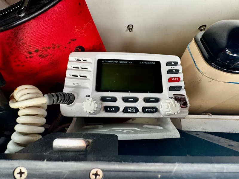 Slide: The Image of Marine radio equipment on a 2002 Hydra-Sports 212 CC boat dashboard. - 11