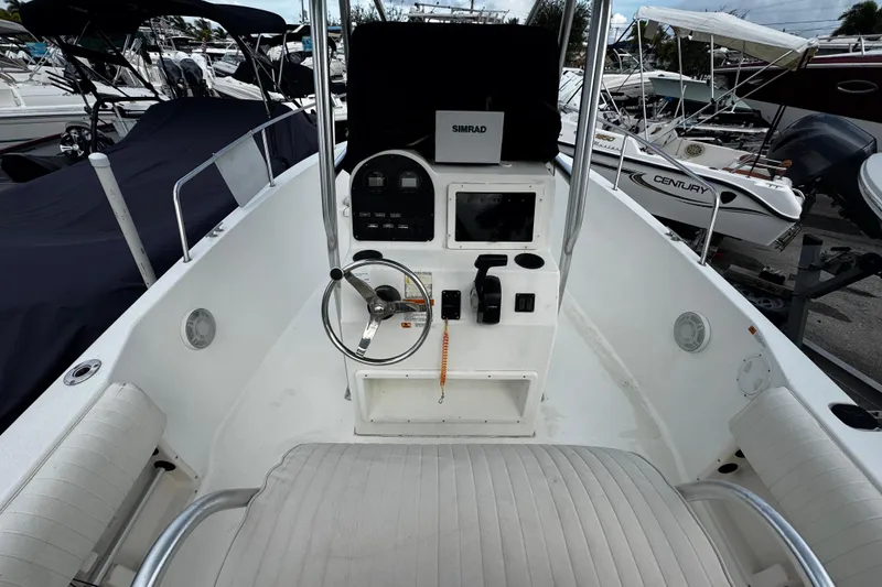 Slide: The Image of 2023 Hydra-Sports 212 CC boat cockpit with steering wheel and control panel. - 7