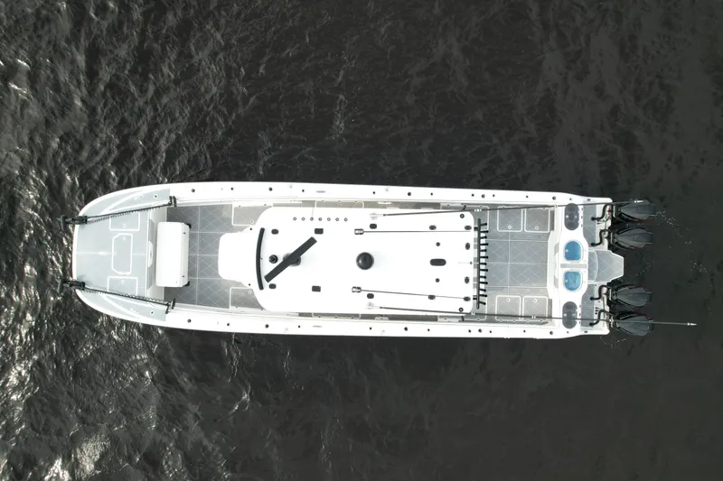 Slide: The Image of Aerial view of 2022 Invincible 46 Catamaran on dark water. - 4