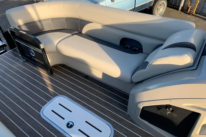 Slide: The Image of Luxurious seating on 2023 Premier 250 SunSation RF pontoon boat with stylish flooring. - 13