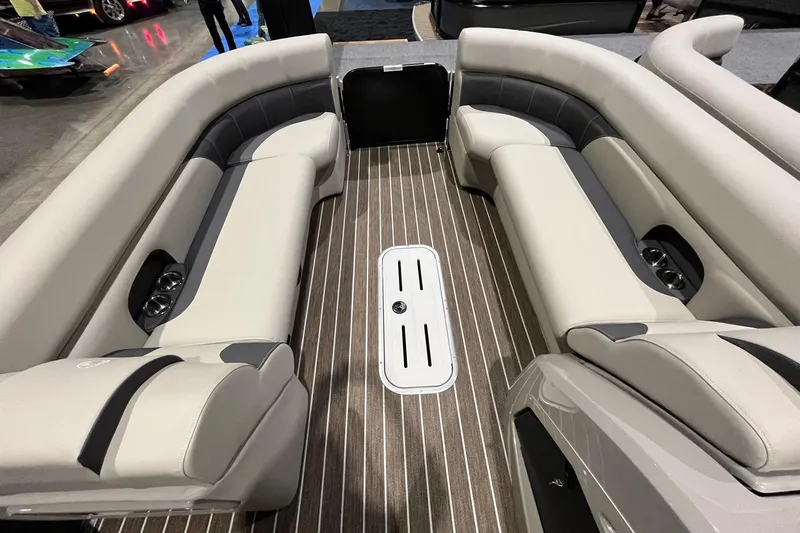 Slide: The Image of 2023 Premier 250 SunSation RF interior with luxurious seating and wood-style flooring. - 4