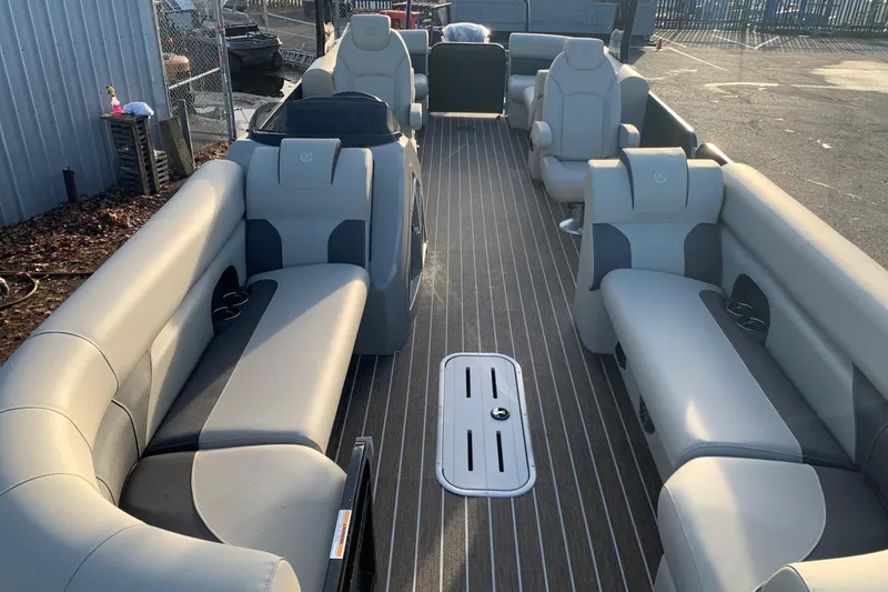 Slide: The Image of 2023 Premier 250 SunSation RF pontoon boat with spacious seating and modern design. - 9