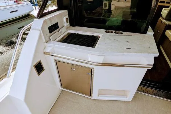 Slide: The Image of Luxurious interior of 2021 Regal 38 XO yacht with plush seating and modern design. - 24