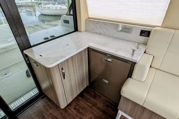 Slide: The Image of Interior of 2021 Regal 38 XO yacht with modern seating and helm. - 27