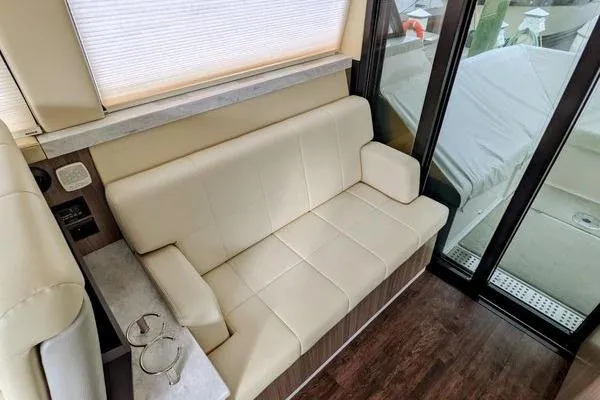 Slide: The Image of 2021 Regal 38 XO boat helm with modern controls and steering wheel. - 28