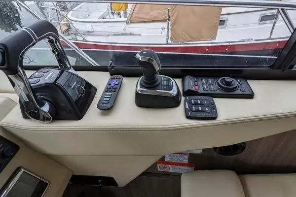 Slide: The Image of Luxurious interior of 2021 Regal 38 XO yacht with modern seating and kitchenette. - 32