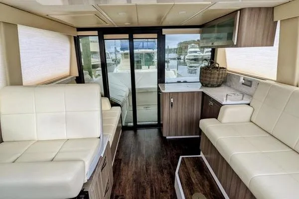 Slide: The Image of 2021 Regal 38 XO yacht interior bedroom with cozy bed and modern design. - 33