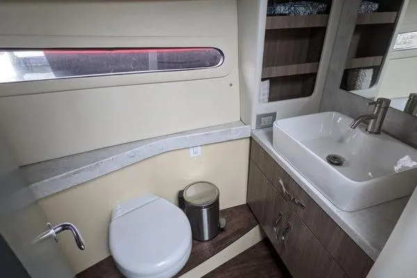 Slide: The Image of 2021 Regal 38 XO interior cabin with wooden bench and window. - 36