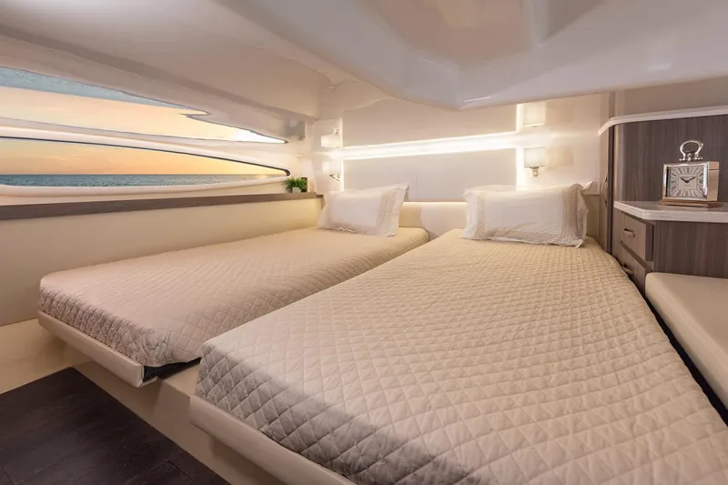 Slide: The Image of 2021 Regal 38 XO cabin interior with wood cabinetry and window view. - 39