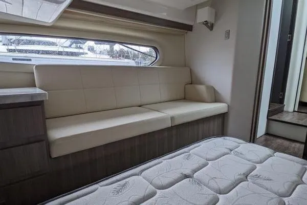 Slide: The Image of 2021 Regal 38 XO yacht docked at marina under clear blue sky. - 43