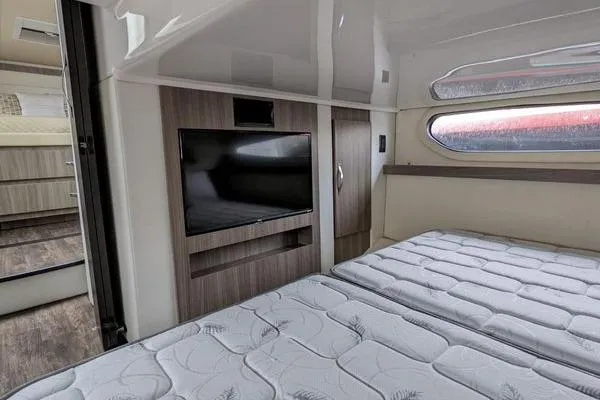 Slide: The Image of 2021 Regal 38 XO yacht with Garmin radar and domes, docked in a marina. - 44