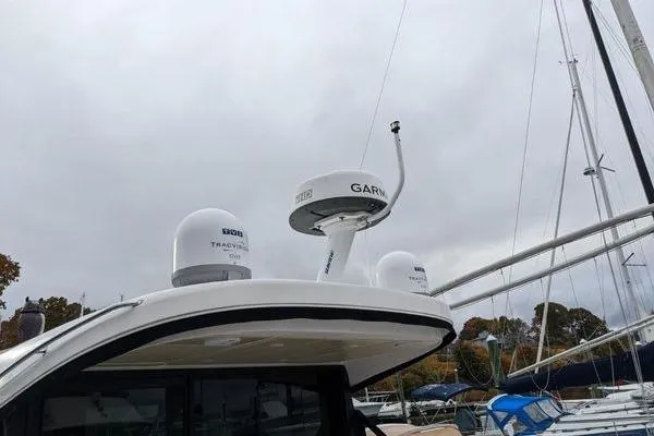 Slide: The Image of Electrical control panel on a 2021 Regal 38 XO boat, featuring various switches and gauges. - 47