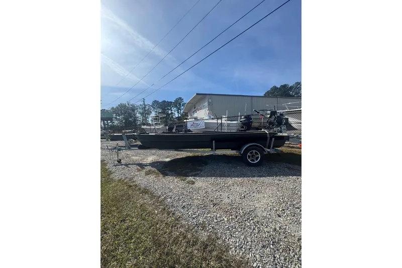 The Image of 2026 Go-Devil 18x54 Surface Drive Boat on trailer, parked outdoors. - 0