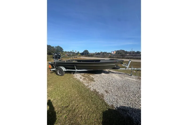 Slide: The Image of 2026 Go-Devil 18x54 Surface Drive Boat on trailer, parked outdoors. - 4