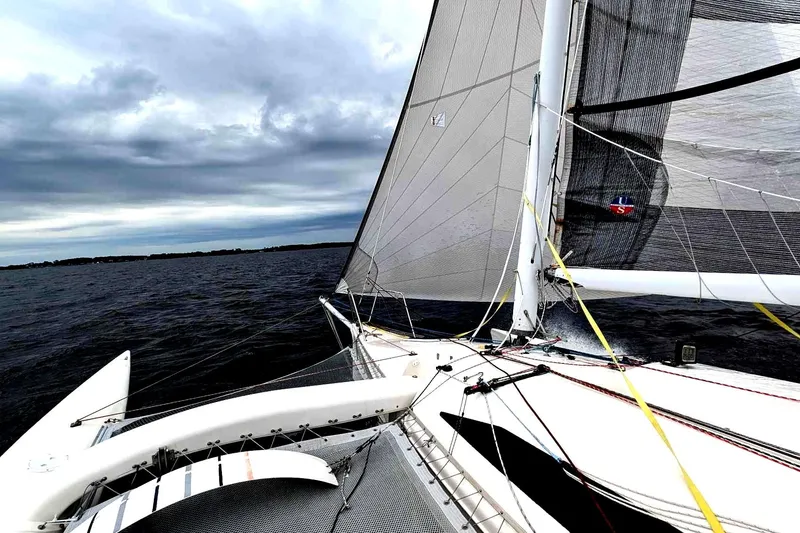 Slide: The Image of Sailing on a 2005 Corsair F-31 1D trimaran under cloudy skies. - 11
