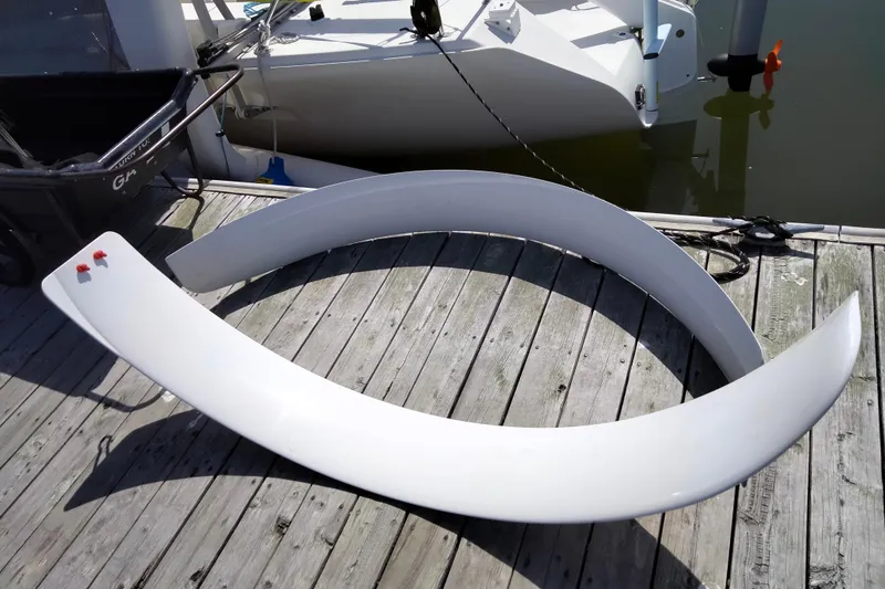 Slide: The Image of White Corsair F-31 1D boat component on wooden dock, 2005 model. - 6