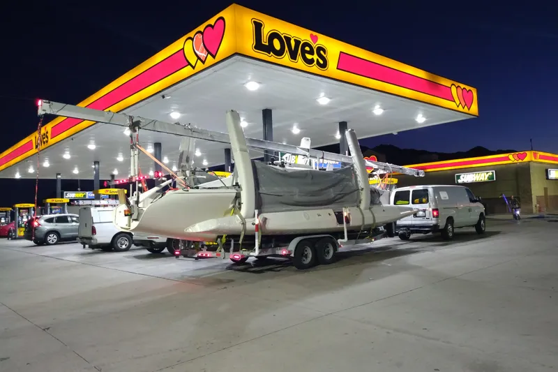Slide: The Image of Corsair F-31 1D trimaran on trailer at Love's gas station, night scene, 2005 model. - 8