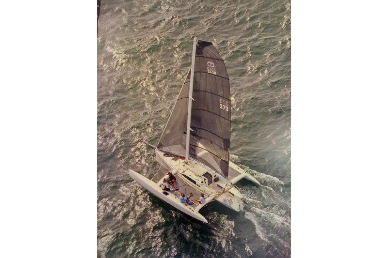 Slide: The Image of Aerial view of 2005 Corsair F-31 1D trimaran sailing on open water. - 9