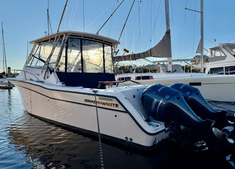 The Image of 2004 Grady-White Express 330 boat docked with Yamaha engines. - 0