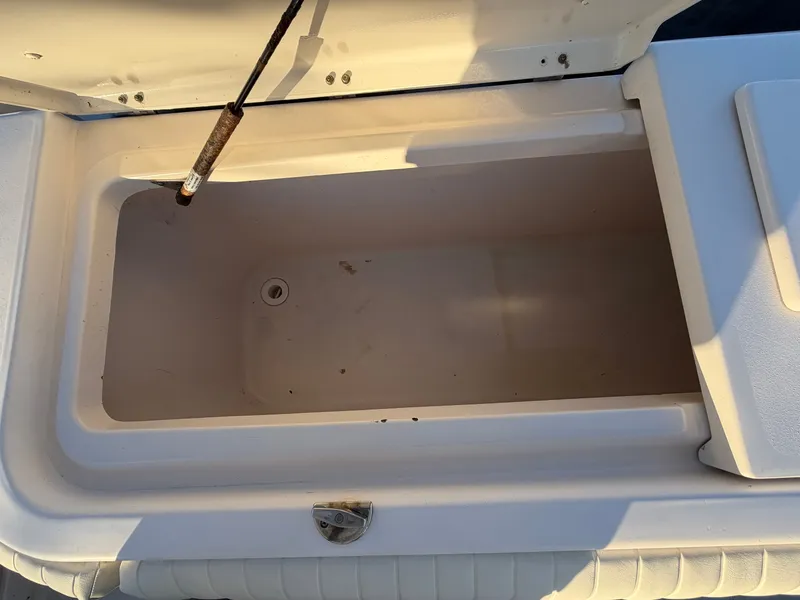 Slide: The Image of Open storage compartment on a 2004 Grady-White Express 330 boat. - 13