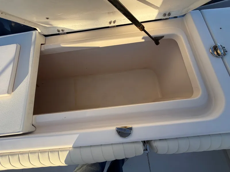Slide: The Image of Open storage compartment on a 2004 Grady-White Express 330 boat. - 14