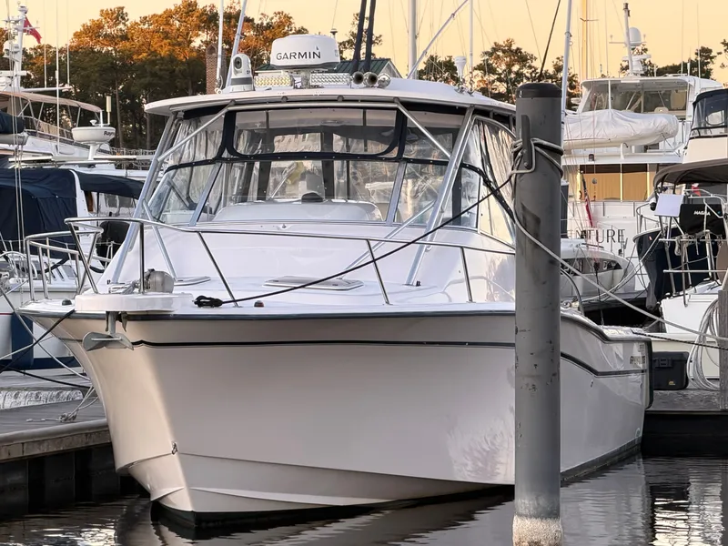 Slide: The Image of 2004 Grady-White Express 330 boat docked at marina. - 2