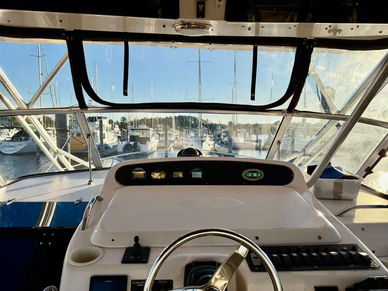 Slide: The Image of Interior view of a 2004 Grady-White Express 330 boat in harbor. - 24