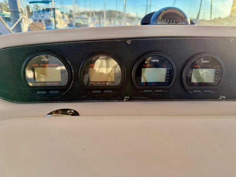 Slide: The Image of Dashboard of a 2004 Grady-White Express 330 boat with Yamaha gauges. - 25