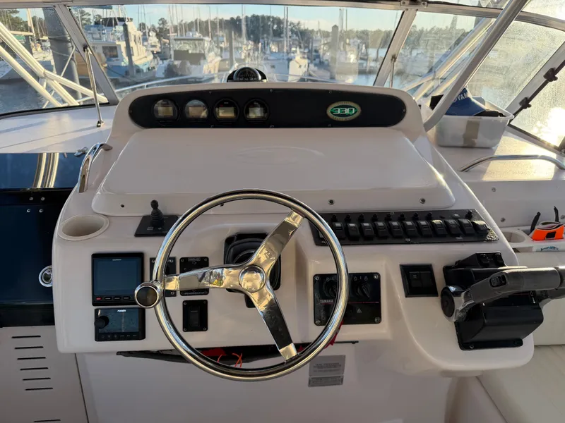 Slide: The Image of Helm of a 2004 Grady-White Express 330 boat. - 28