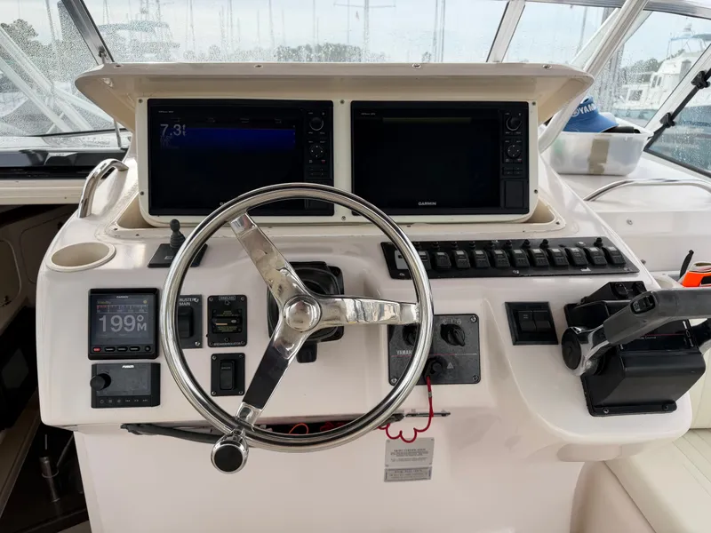 Slide: The Image of Helm console of a 2004 Grady-White Express 330 boat. - 29