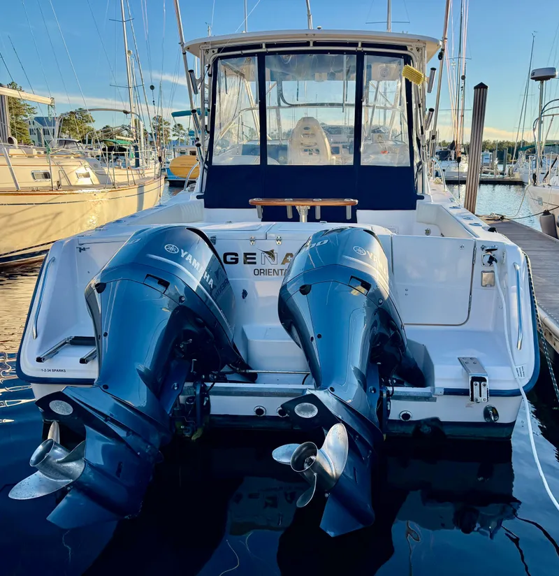 Slide: The Image of 2004 Grady-White Express 330 boat with Yamaha engines at the dock. - 3