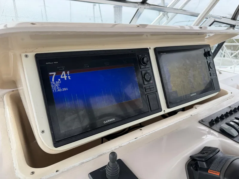 Slide: The Image of Garmin displays on Grady-White Express 330 boat, year 2004. - 30