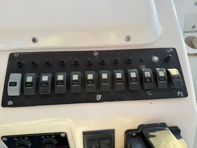 Slide: The Image of Control panel of a 2004 Grady-White Express 330 boat. - 32