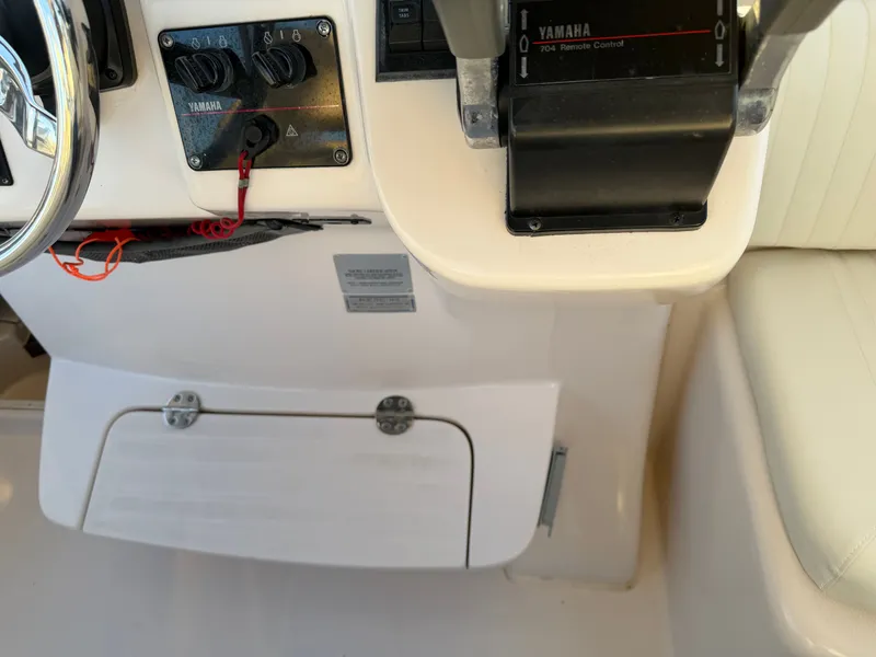 Slide: The Image of Control console of a 2004 Grady-White Express 330 boat. - 34