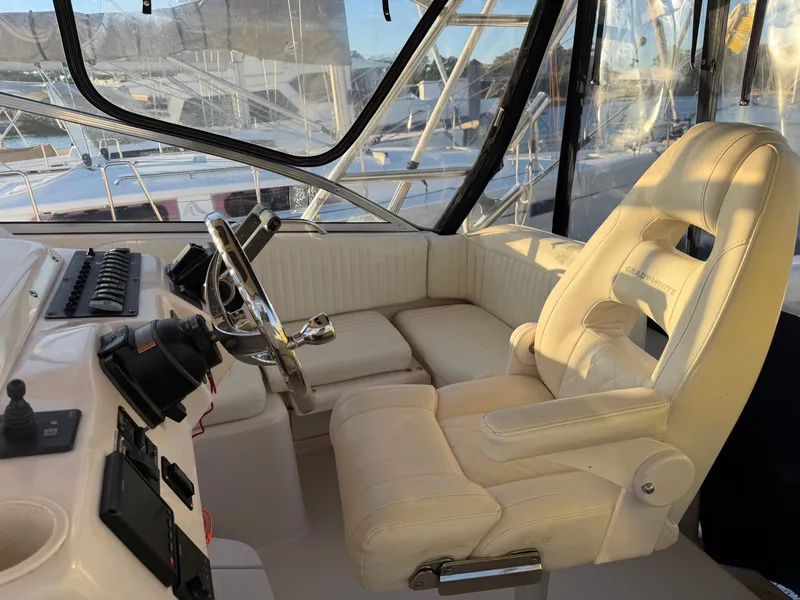 Slide: The Image of Interior of a 2004 Grady-White Express 330 boat with helm station. - 38