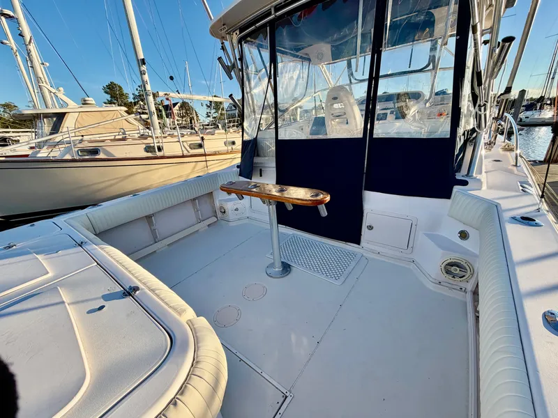 Slide: The Image of 2004 Grady-White Express 330 boat, spacious deck at marina. - 4