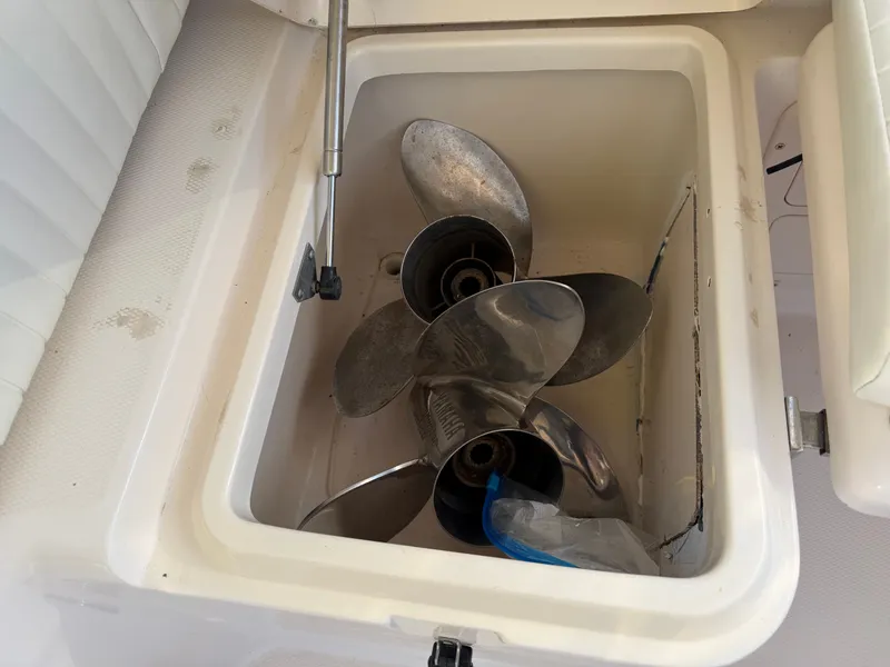 Slide: The Image of Boat propellers in storage compartment of a 2004 Grady-White Express 330. - 43