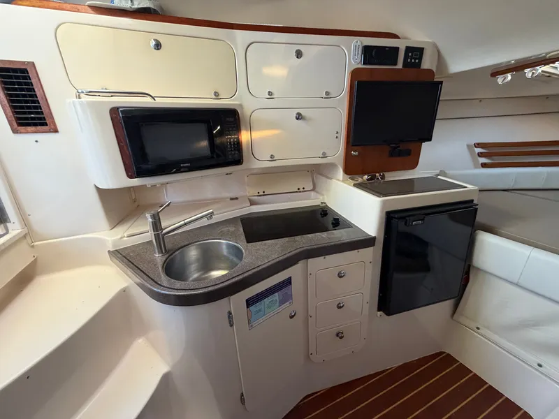 Slide: The Image of Interior of 2004 Grady-White Express 330 yacht kitchen. - 47