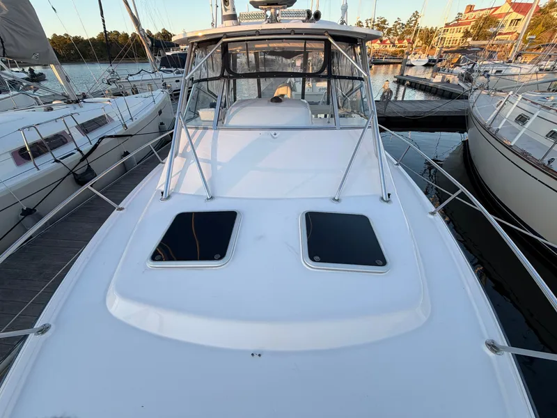 Slide: The Image of 2004 Grady-White Express 330 boat docked in marina. - 8